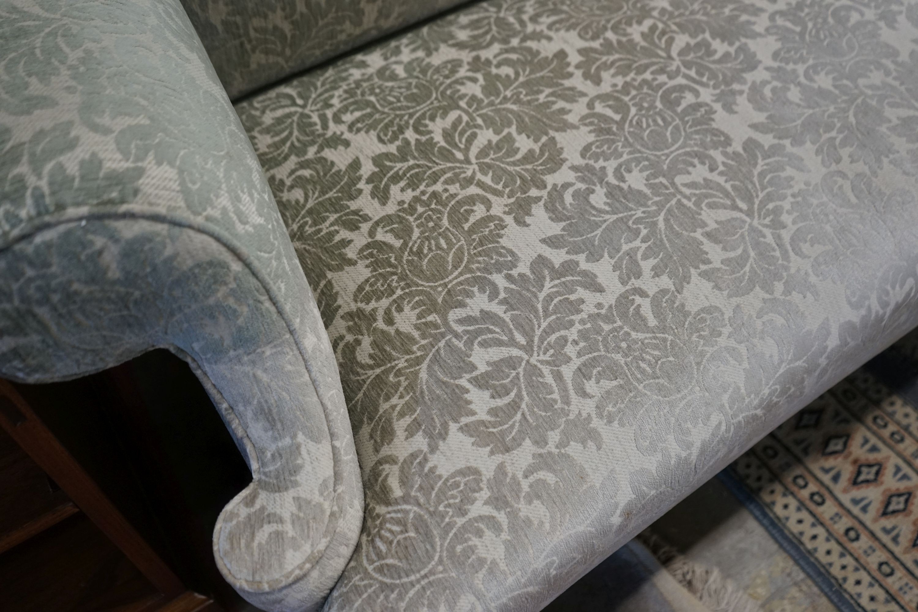 A George III style upholstered two seater settee, length 166cm, depth 72cm, height 99cm